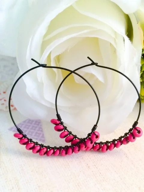 Pink beaded black hoops by Ritu Java